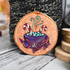 The candy cane cauldron dragon pyrography hanging wood slice decoration