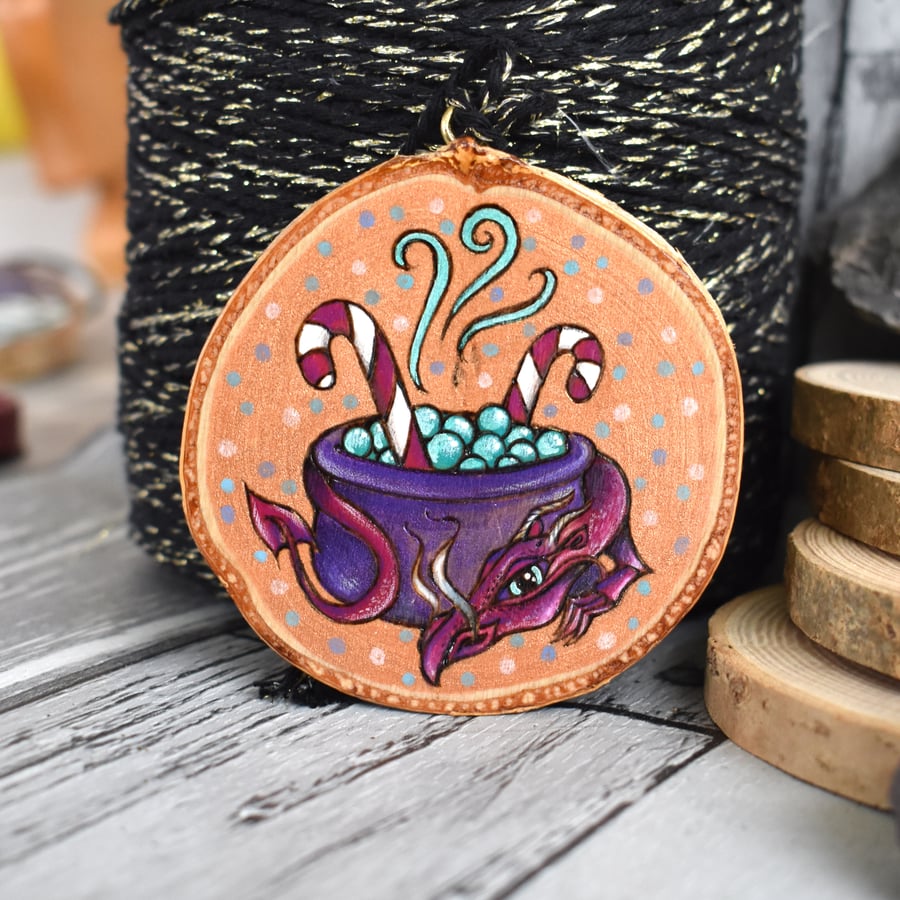 The candy cane cauldron dragon pyrography hanging wood slice decoration