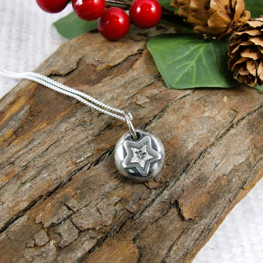 Silver Necklace. Sterling Silver Pebble with Star and Tiny Interlocked Hearts