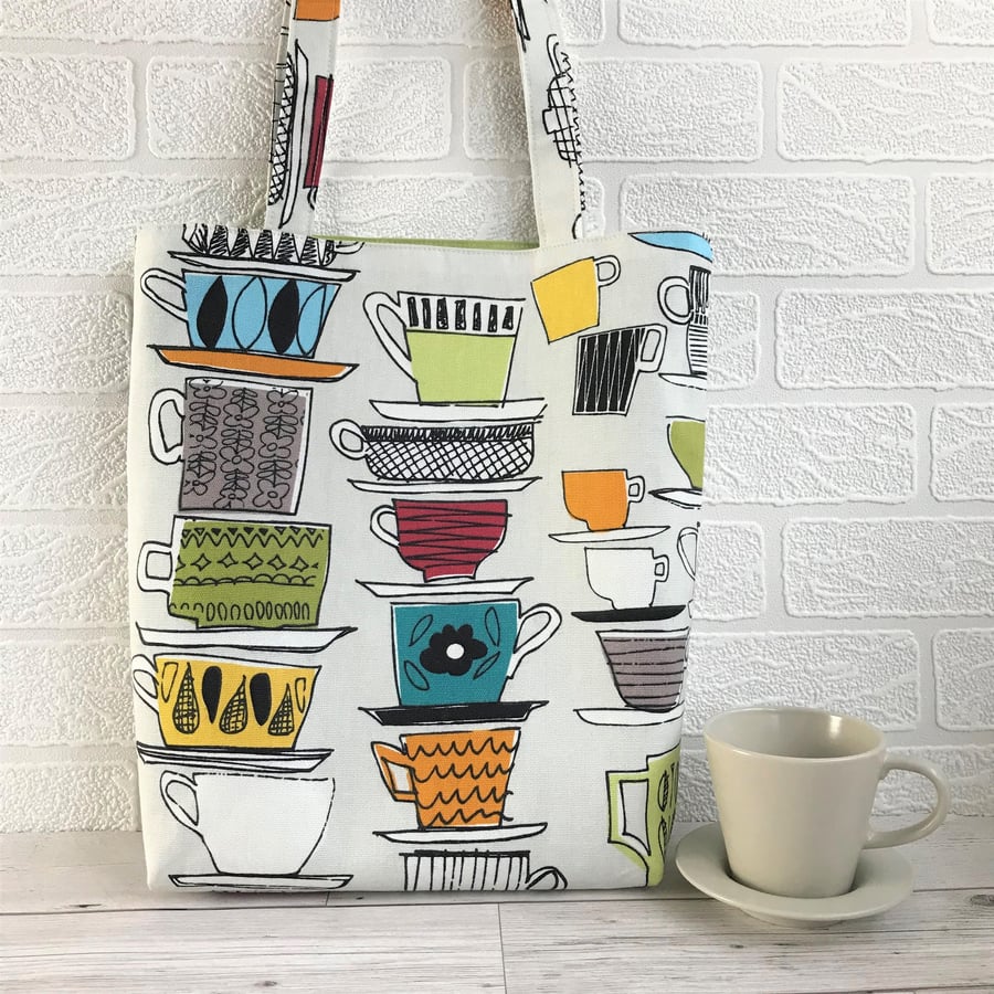 Teacups tote bag in cream with colourful cups and saucers print pattern