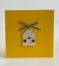 'New home' card with detachable decoration
