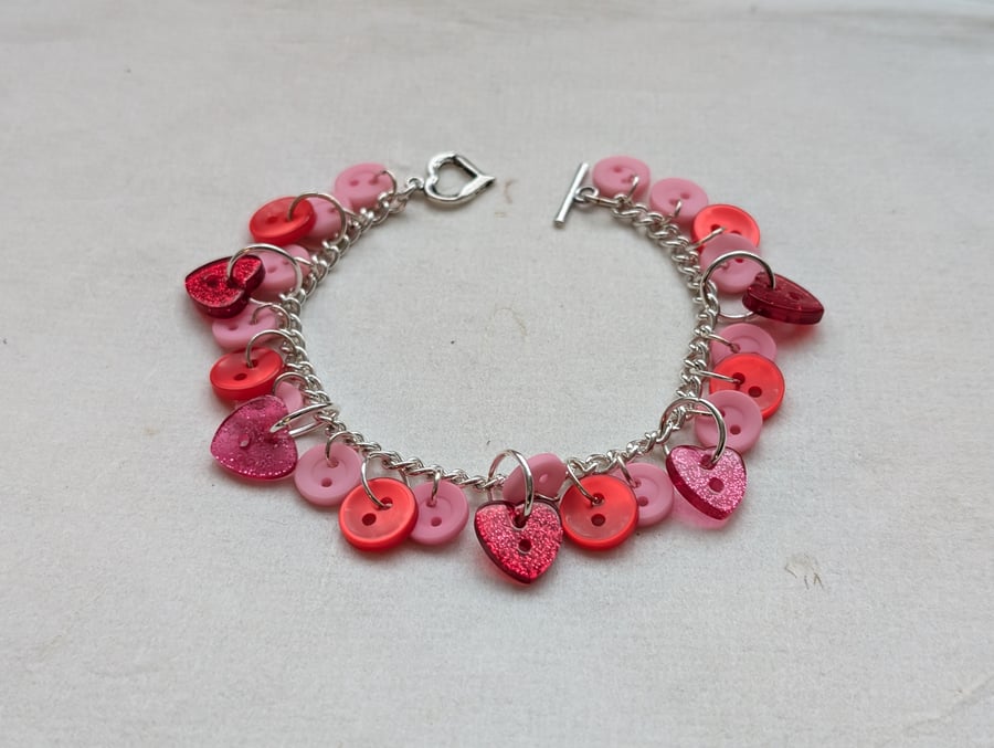Pink and red button bracelet with heart toggle clasp 