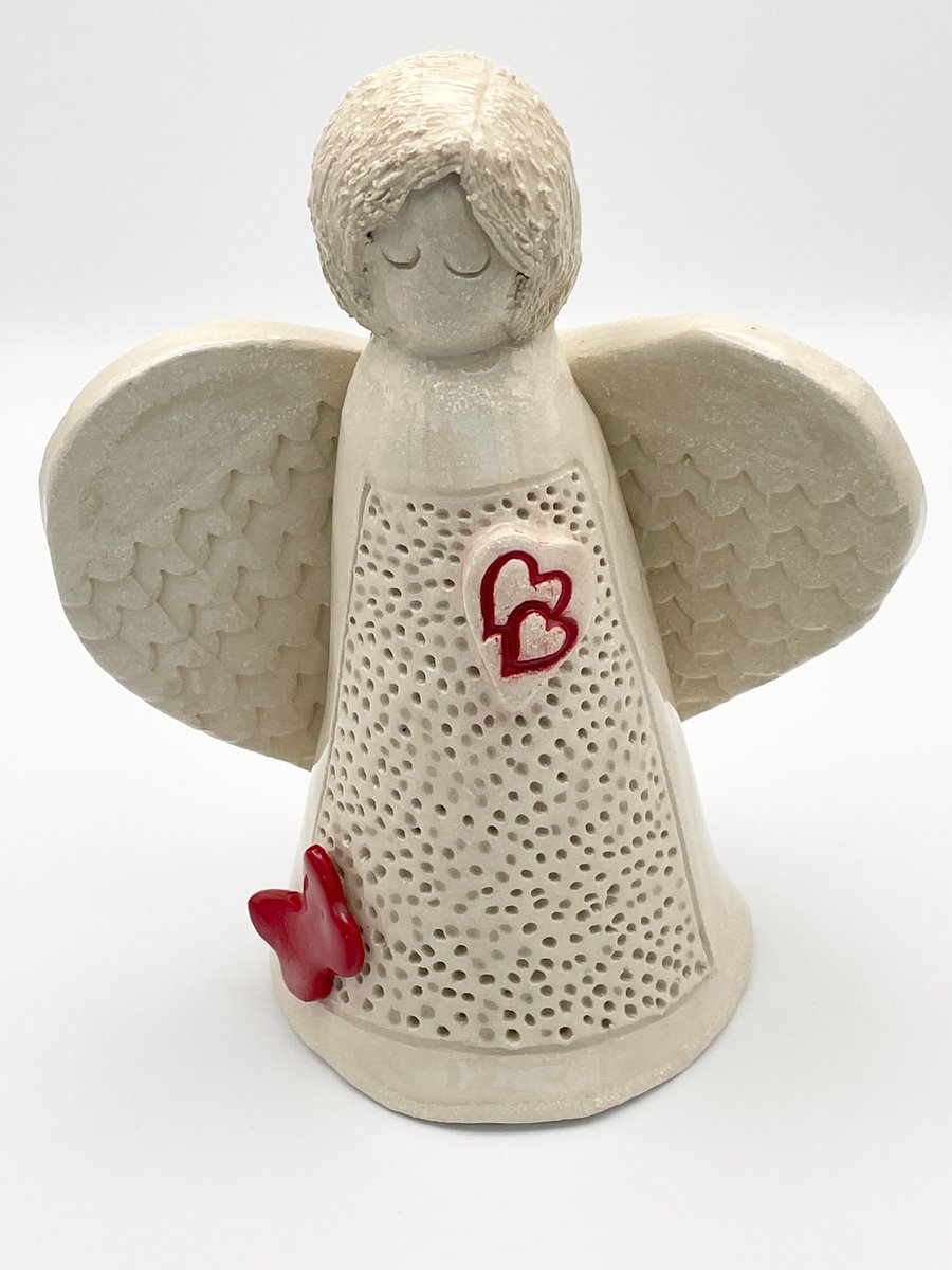 Angel sculpture with hearts and butterfly 