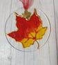 Maple leaf sun catcher decoration. 