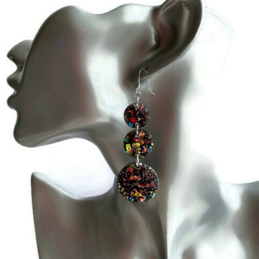 Black glitter dangle circle earrings with sterling silver ear wires.