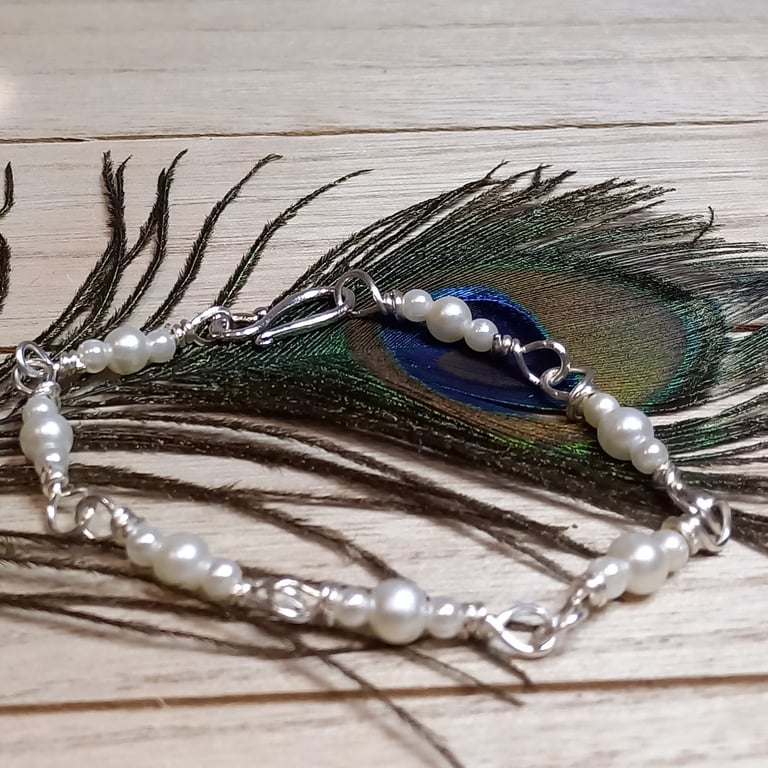 Twisted silver plated copper bracelet with pearls