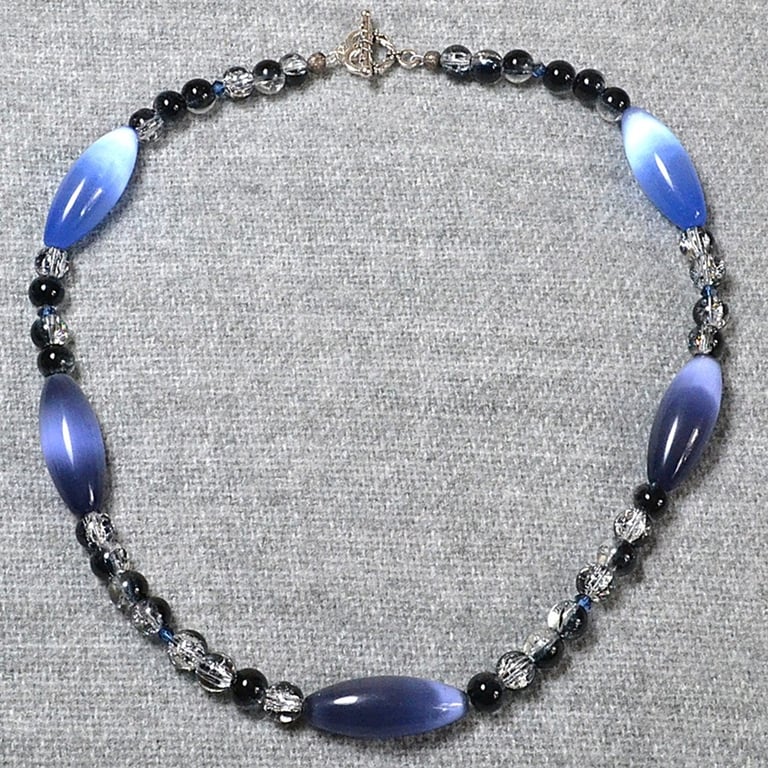 Shimmering Blue Glass Oval Tube and Clear & Black Glass Crackle Bead Necklace