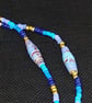Long Summer Swirl Beaded Necklace in shades of blue with handmade paper beads - Image 3