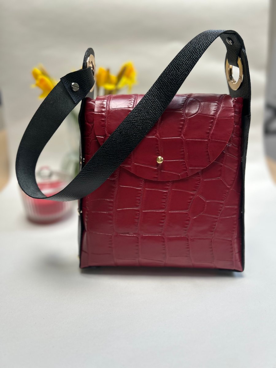 Red and black leather bag 