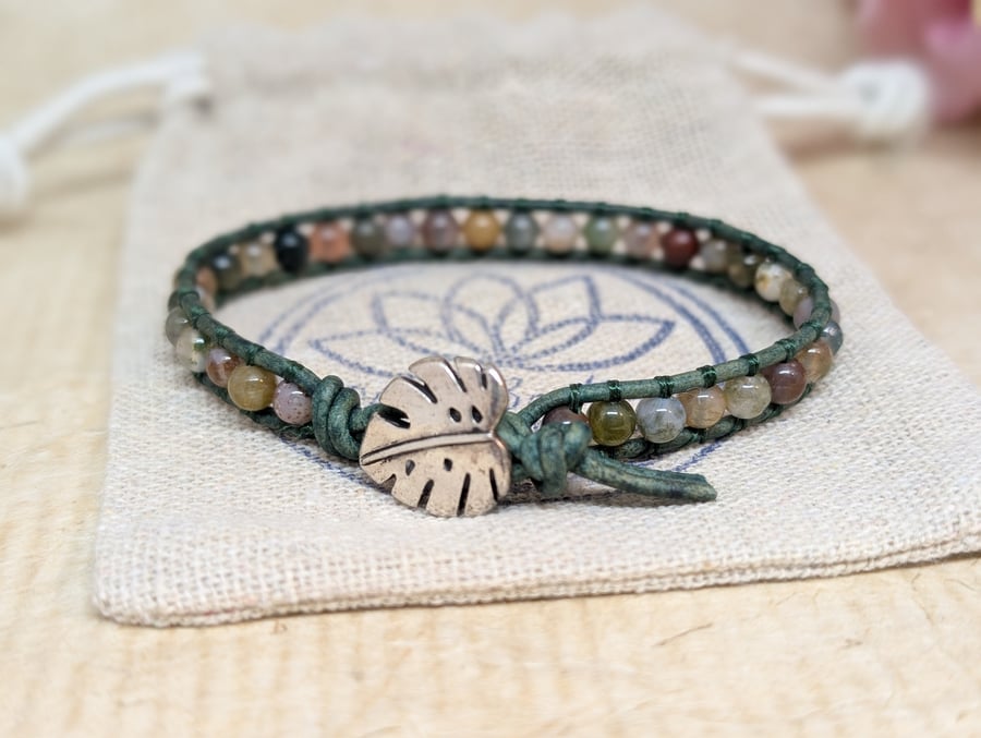 Green leather and jasper bracelet with monstera leaf button fastener