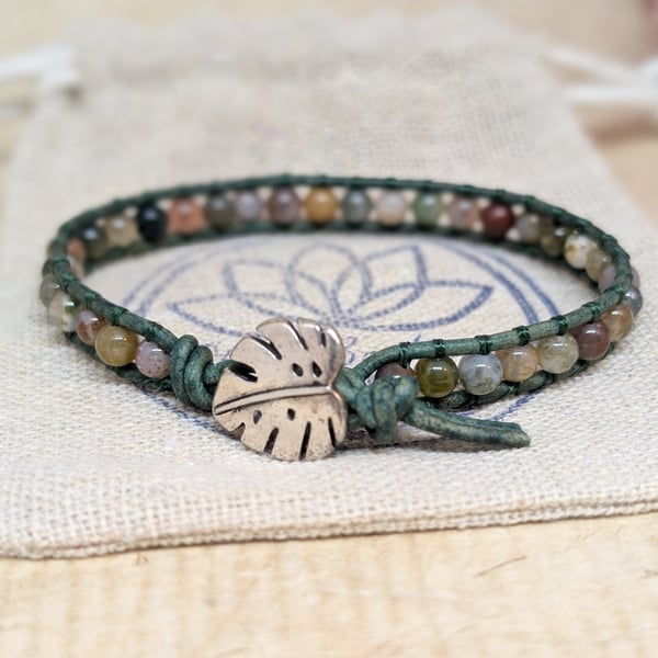 Green leather and jasper bracelet with monstera leaf button fastener