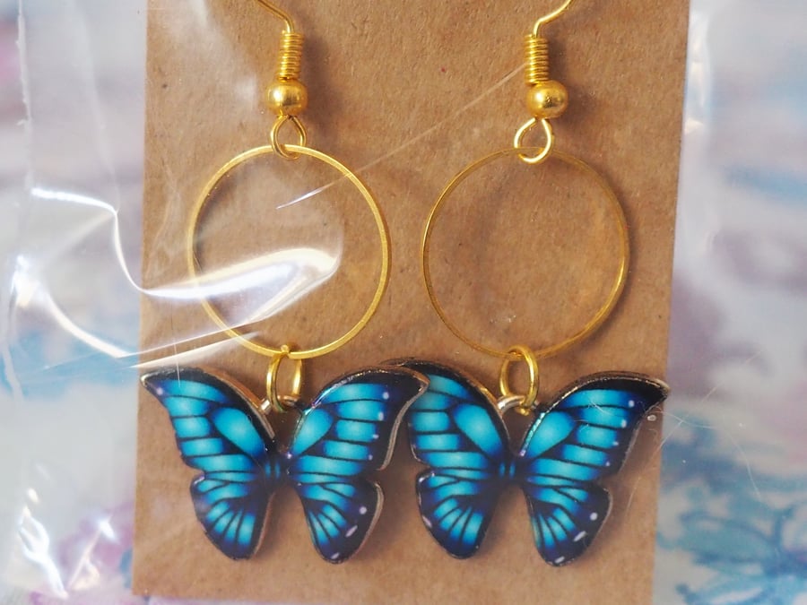 Gold Earrings with Blue Butterfly Charms and Small Circles 