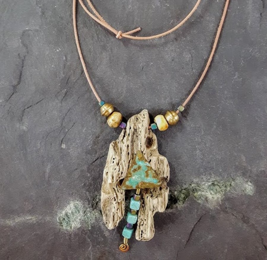 Pendant driftwood verdigris brass hematite turquoise gemstones.