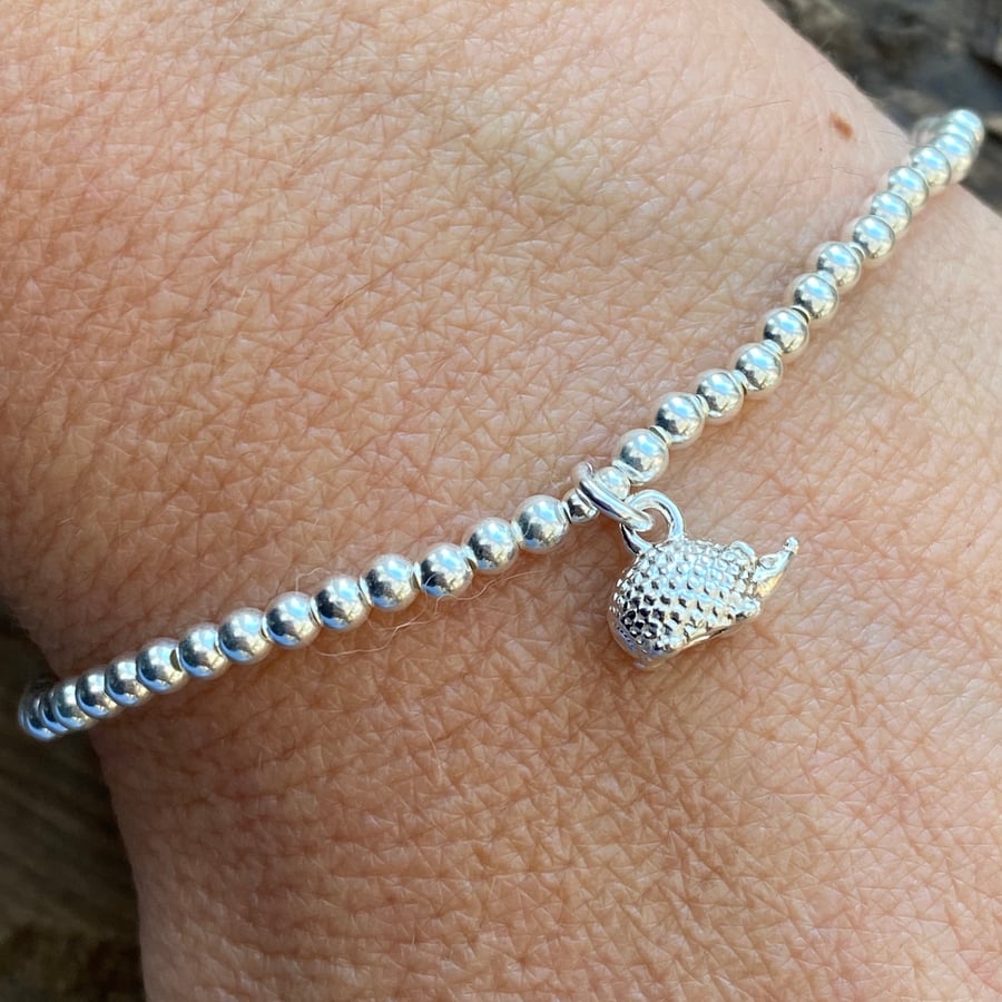 Sterling silver bead bracelet with hedgehog charm. Stretch bracelet. 