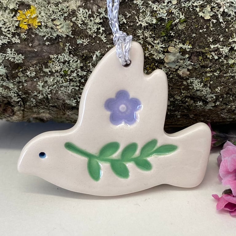 Teeny ceramic dove decoration with leaves and lilac flower
