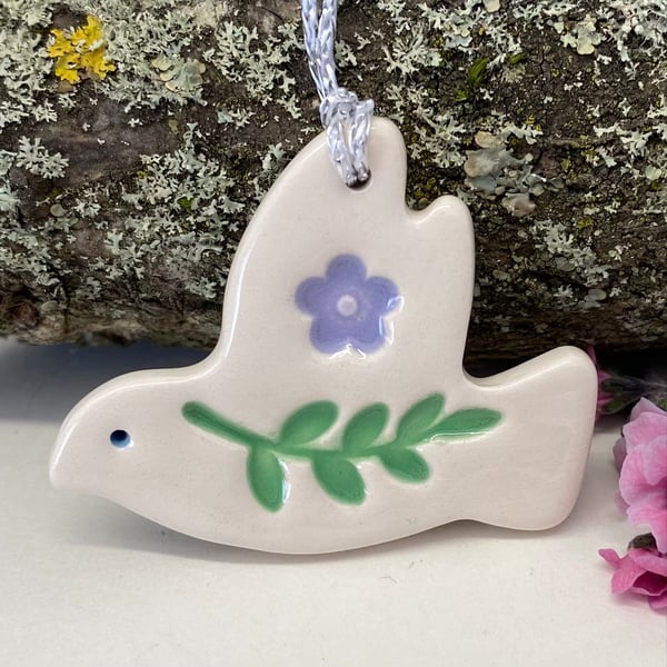Teeny ceramic dove decoration with leaves and lilac flower