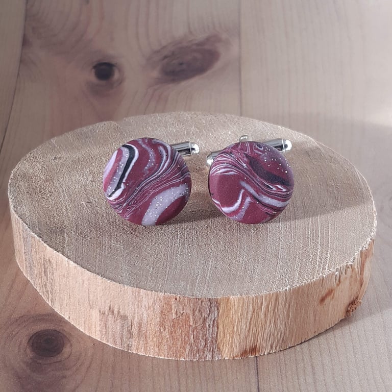 Men's cufflinks in a cerise, black and white swirl design