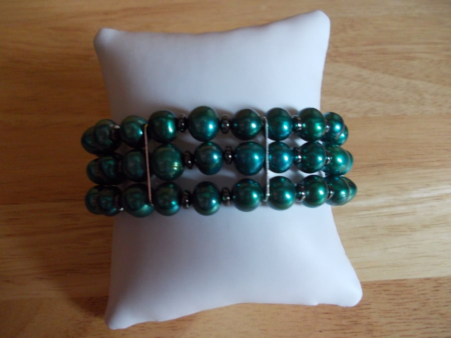 Teal pearl and haematite three strand bracelet