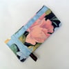 Glasses case in a dark blue floral print