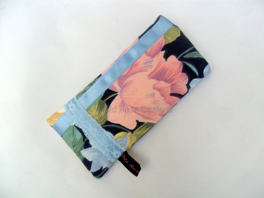 Glasses case in a dark blue floral print
