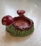 Handmade clay tree stump and mushroom tea light holder