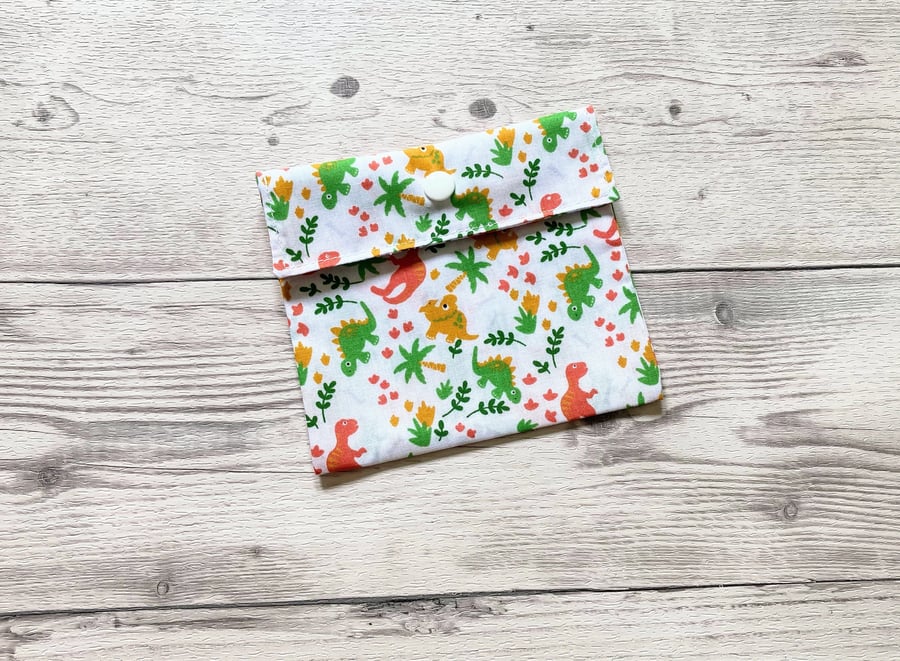 Dinosaurs themed discreet sanitary polycotton white fabric pouch.