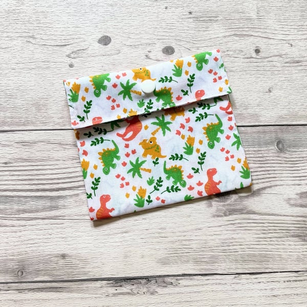 Dinosaurs themed discreet sanitary polycotton white fabric pouch.