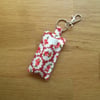 Key ring in floral fabric to hold lip balm