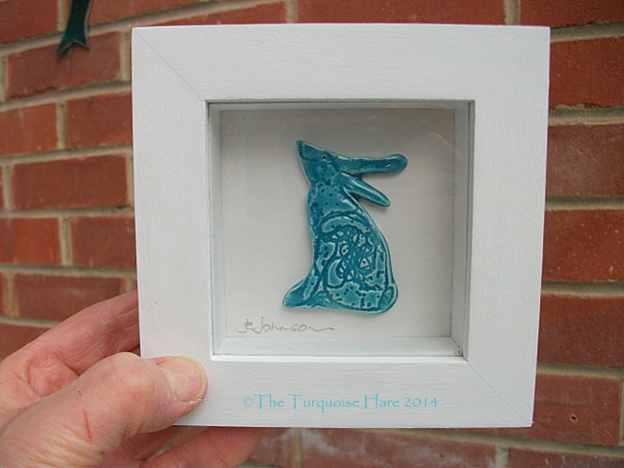 Ceramic turquoise moon gazing hare in a white rustic box frame