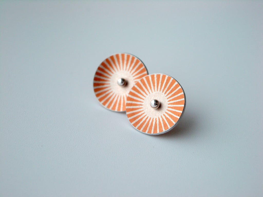 Orange and silver sunburst circle studs