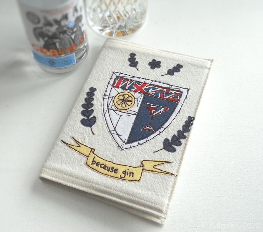 applique & freehand embroidered A6 notebook - gin coat of arms