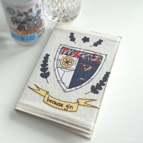 applique & freehand embroidered A6 notebook - gin coat of arms