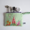 Make up bag, cosmetics bag, or purse, made from floral vintage embroidery.