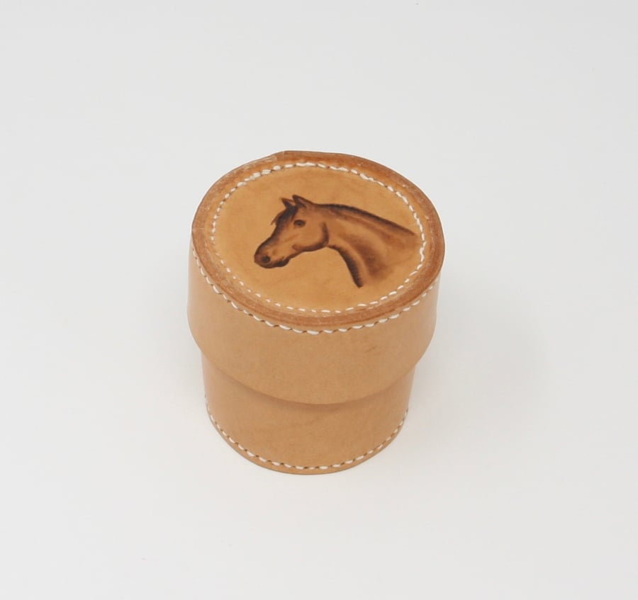 Small round leather trinket box with horse's head motif
