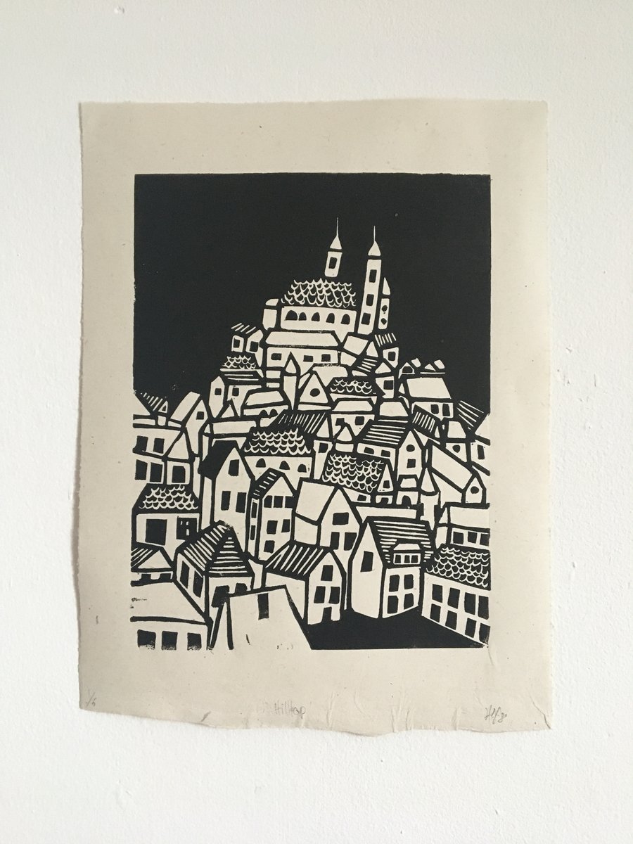 Hilltop, linocut print of a hill top town on handmade paper.