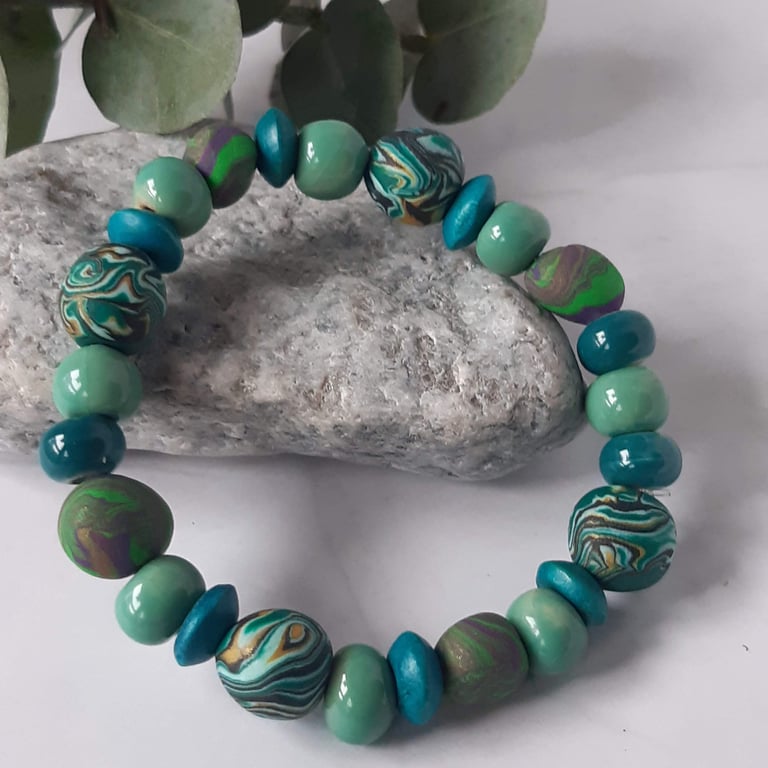 Polymer clay bracelet in aqua tones