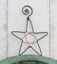 Green Wire Star Decoration with a Red Centre