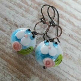 Copper earrings with blue white lampwork cat beads