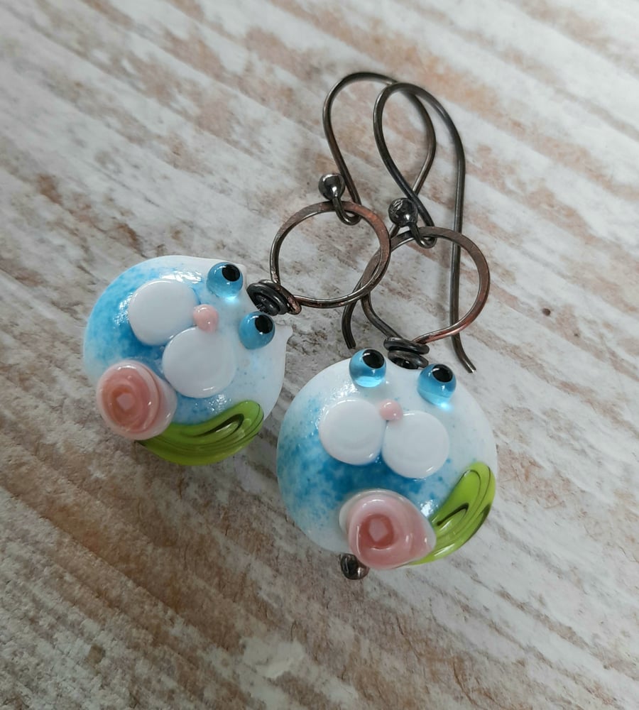 Copper earrings with blue white lampwork cat beads