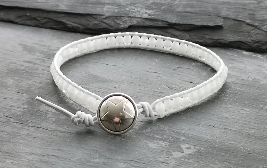White leather and glass bead bracelet with star button