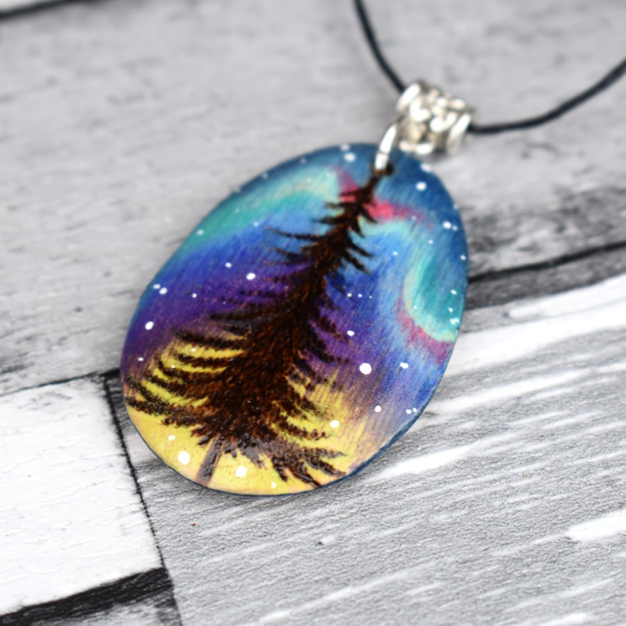 The last tree. Pyrography aurora pine tree inspired wooden pendant.