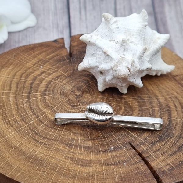 Real cowrie shell preserved in silver, hair clip