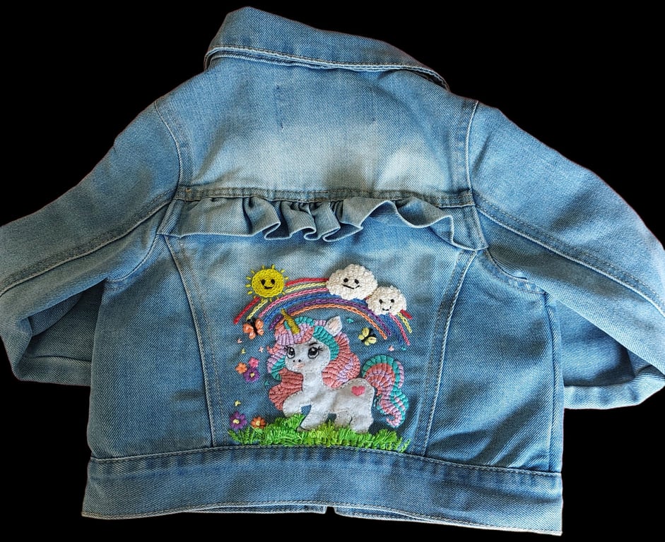 Hand embellished child's denim jacket.  Embellished with a Unicorn and rainbow. 