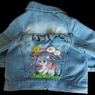 Hand embellished child's denim jacket.  Embellished with a Unicorn and rainbow. 