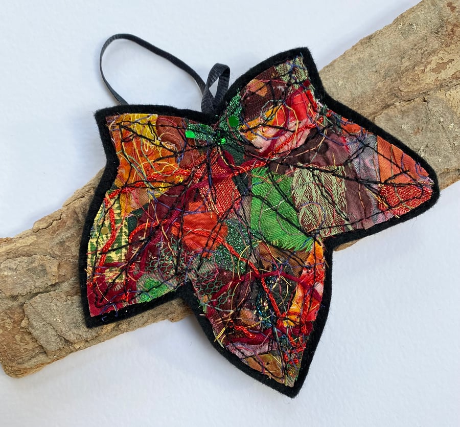 Embroidered up-cycled leaf home decoration.