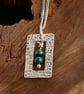 Silver framed pendants with malachite beads