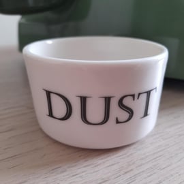 Porcelain vessel with 'dust' wording