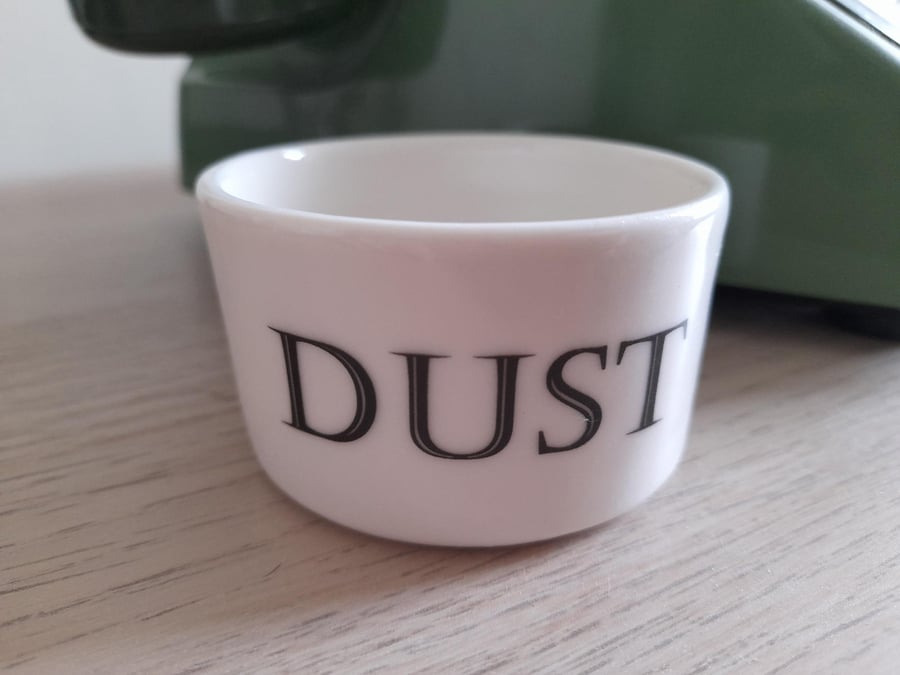 Porcelain vessel with 'dust' wording