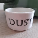 Porcelain vessel with 'dust' wording