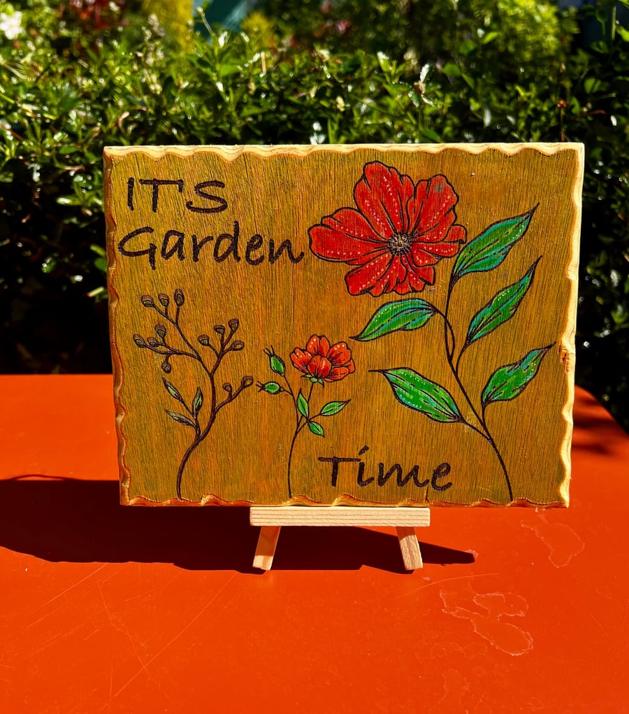 It's Garden time. Wooden sign. 